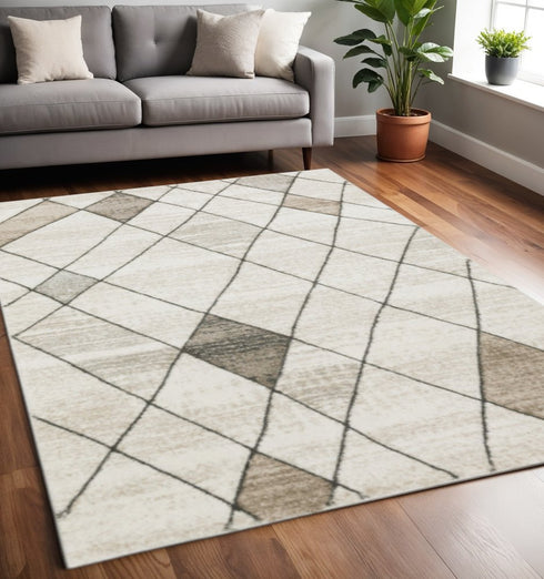 3' X 5' Beige Grey Tan And Brown Geometric Power Loom Stain Resistant Area Rug